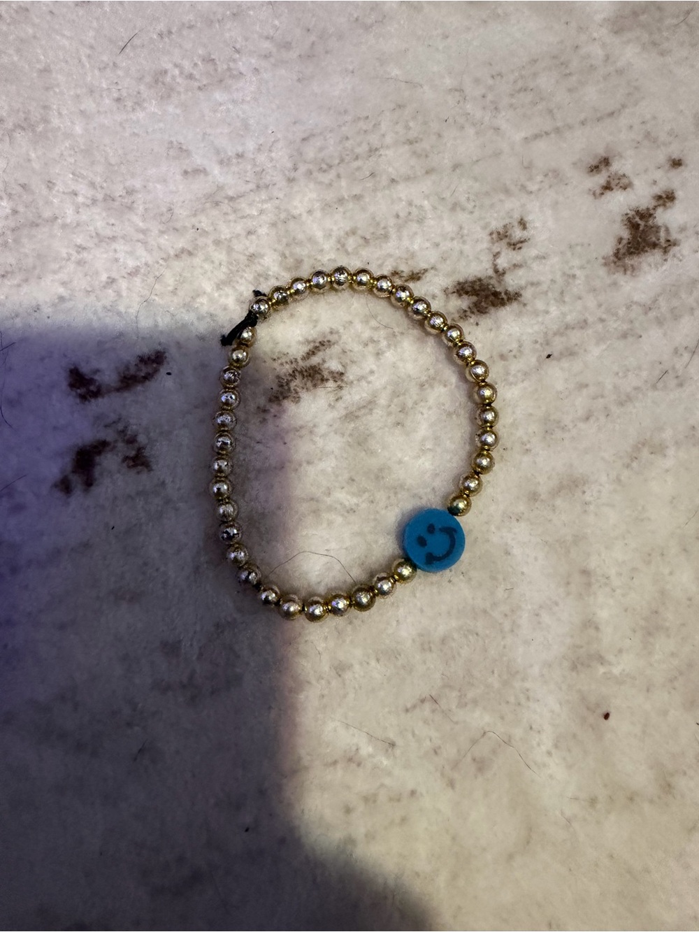 Gold Beaded Bracelet with Blue Smiley Charm